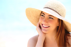 Woman in a beach hat smiling