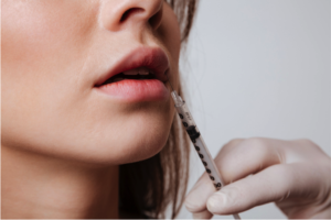 Woman receiving lip filler