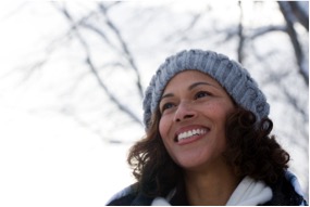 Smiling woman outside in a winter hat