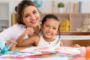 Mom and young daughter painting together