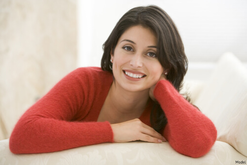 Woman sitting on her couch