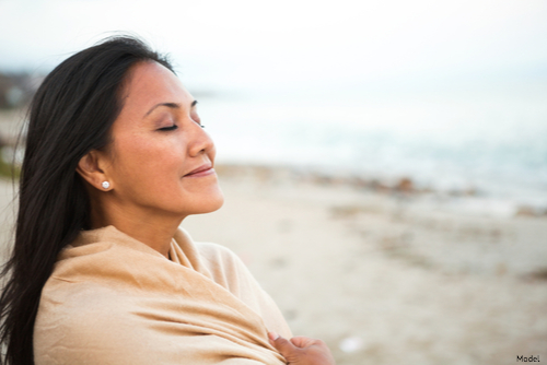 woman sitting on the beach