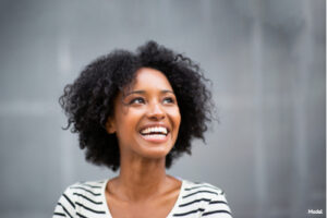 Woman with short black hair smiling