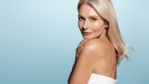 Mature woman has fuller skin with fewer wrinkles after undergoing microneedling treatment.